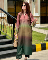 Woman wearing a gradient dress standing outdoors with greenery and steps in the background