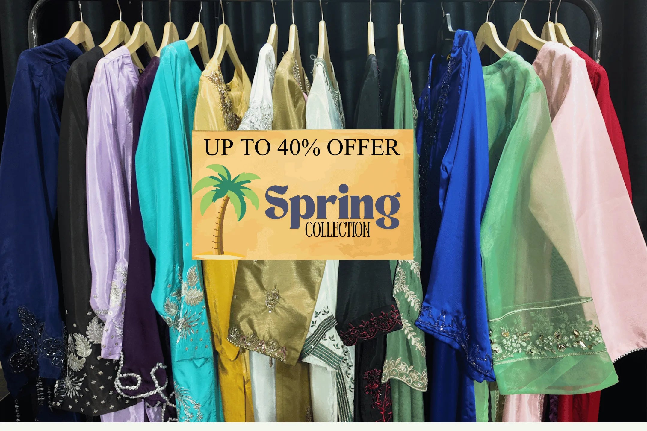 Clothing rack with colorful dresses and a 'Spring Collection' sign with an offer.