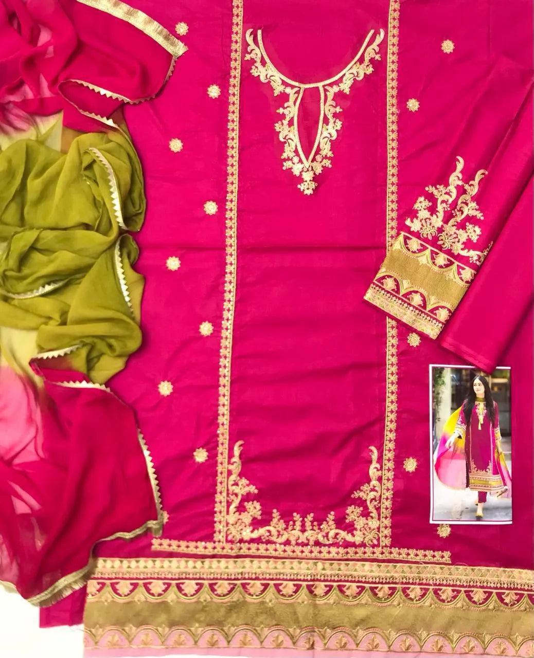 Pink fabric with gold embroidery and green dupatta on a white background