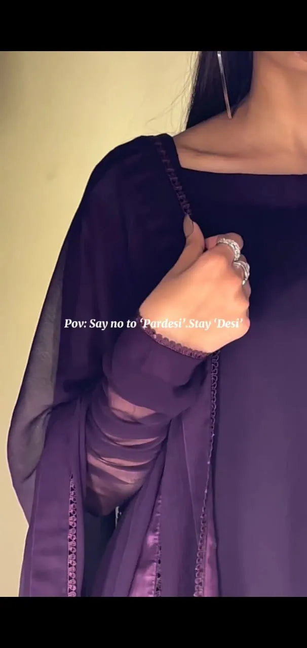Person wearing a purple outfit with text overlay on a plain background