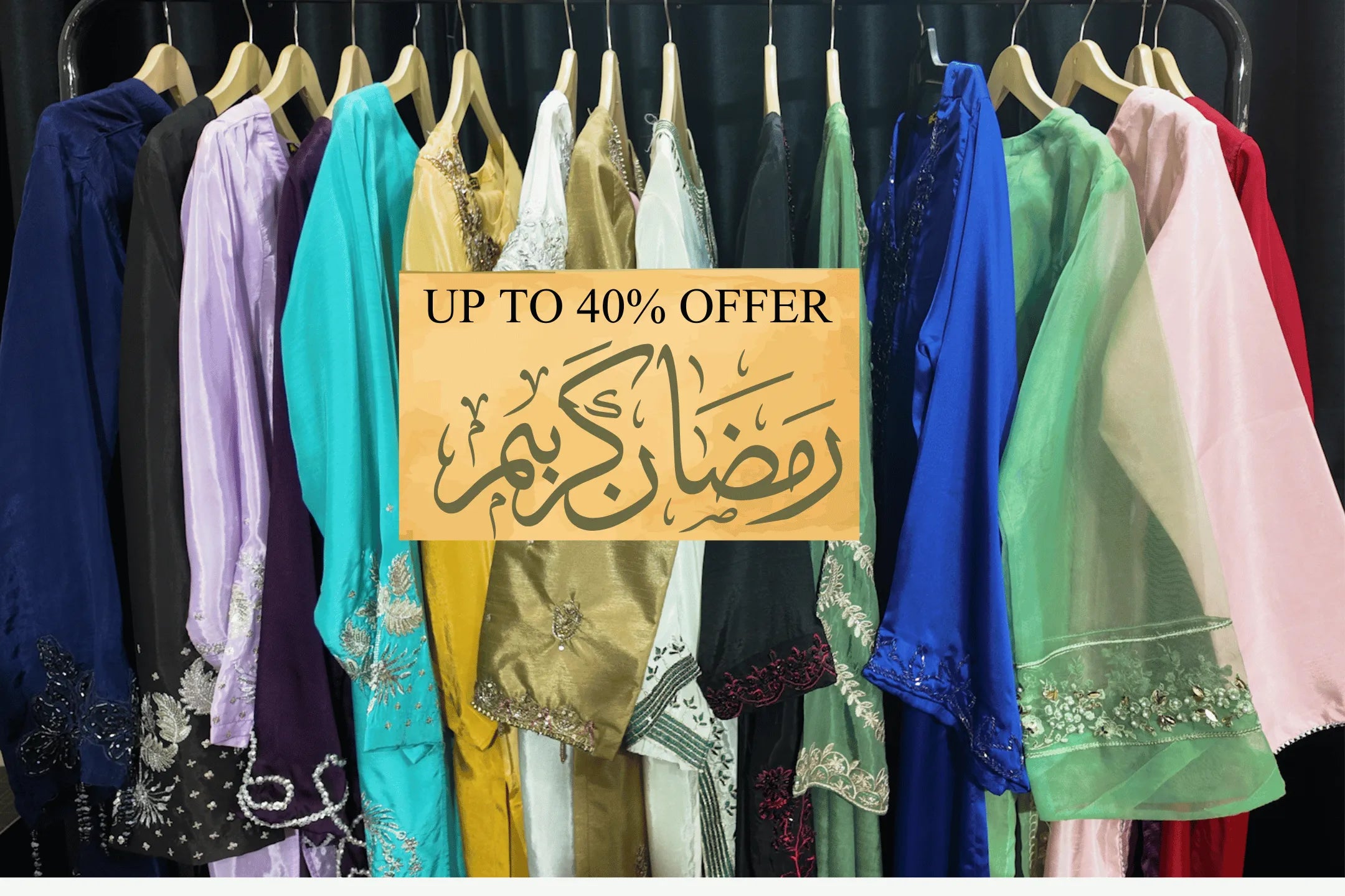 Clothing rack with colorful dresses and a 'Up to 40% Offer' sign.