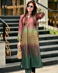 Woman wearing a gradient dress standing on steps outdoors
